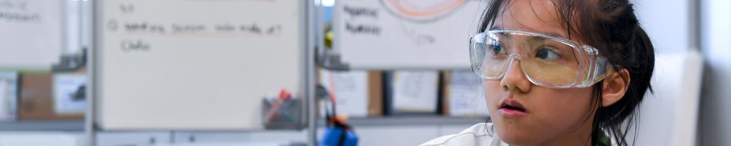 A girl wearing a lab coat