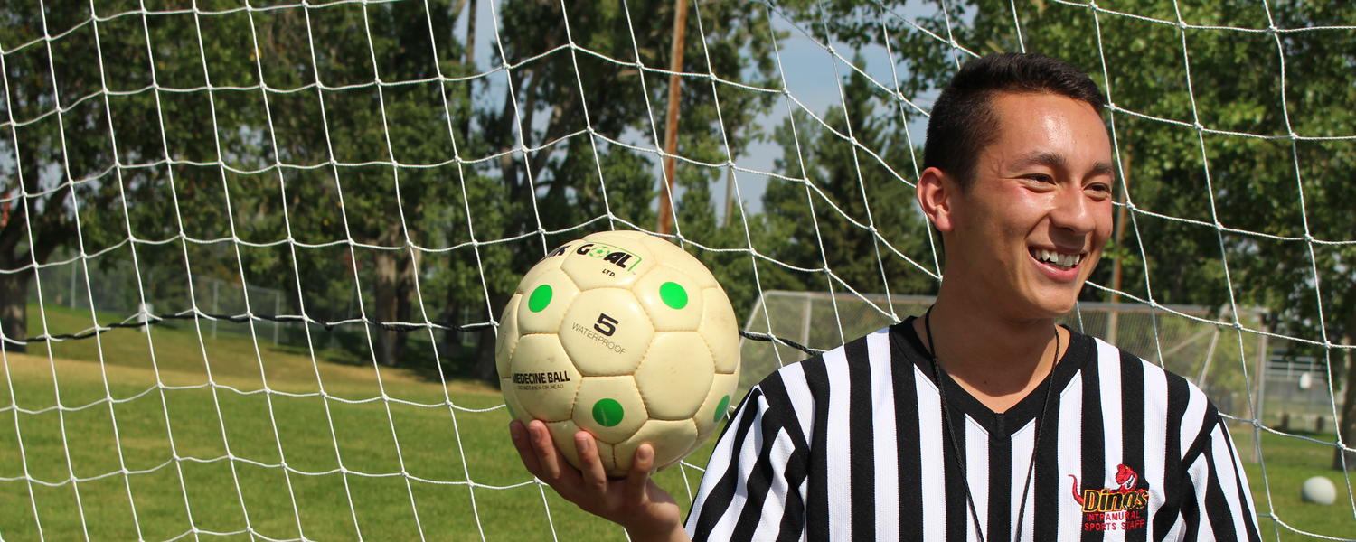Soccer referee with ball