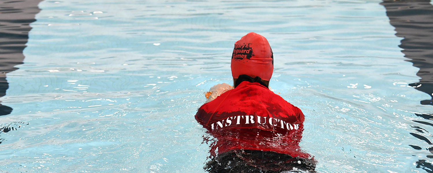 Swimming instructor demonstrating a skill