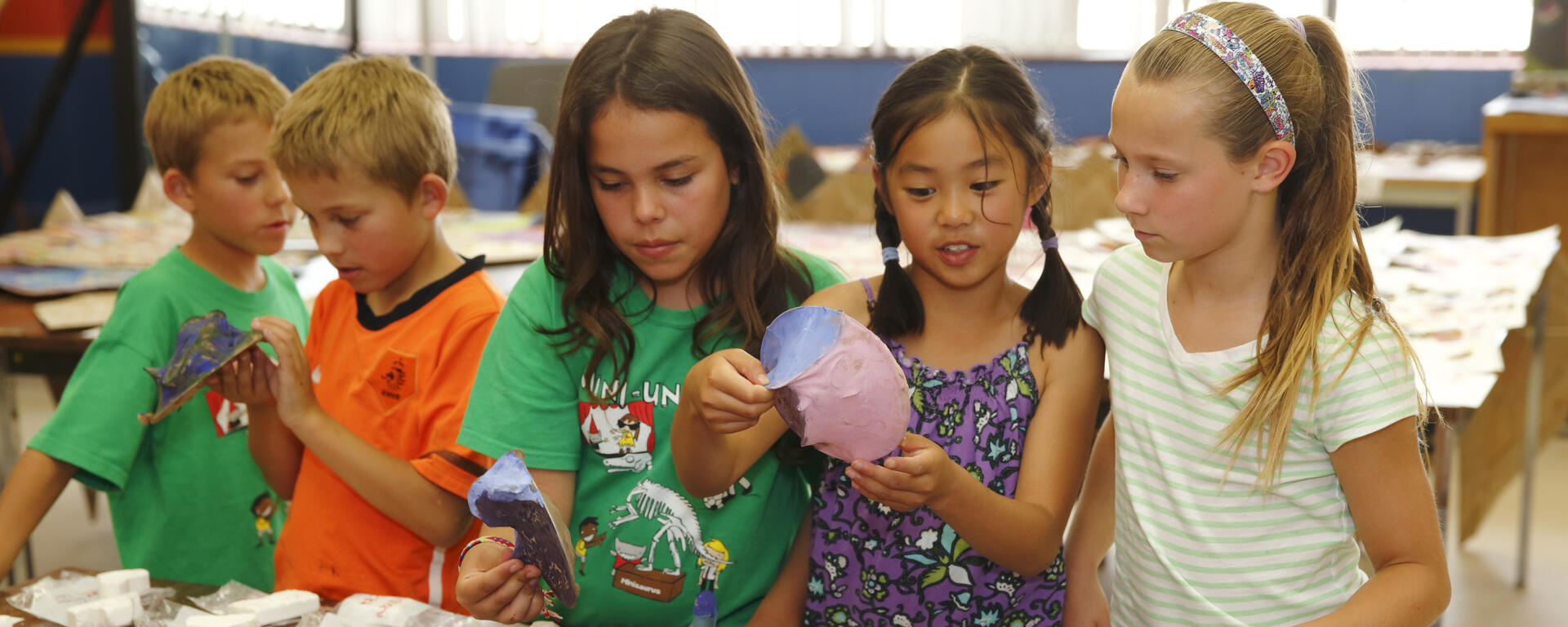 Kids in a group working on birthday activities 