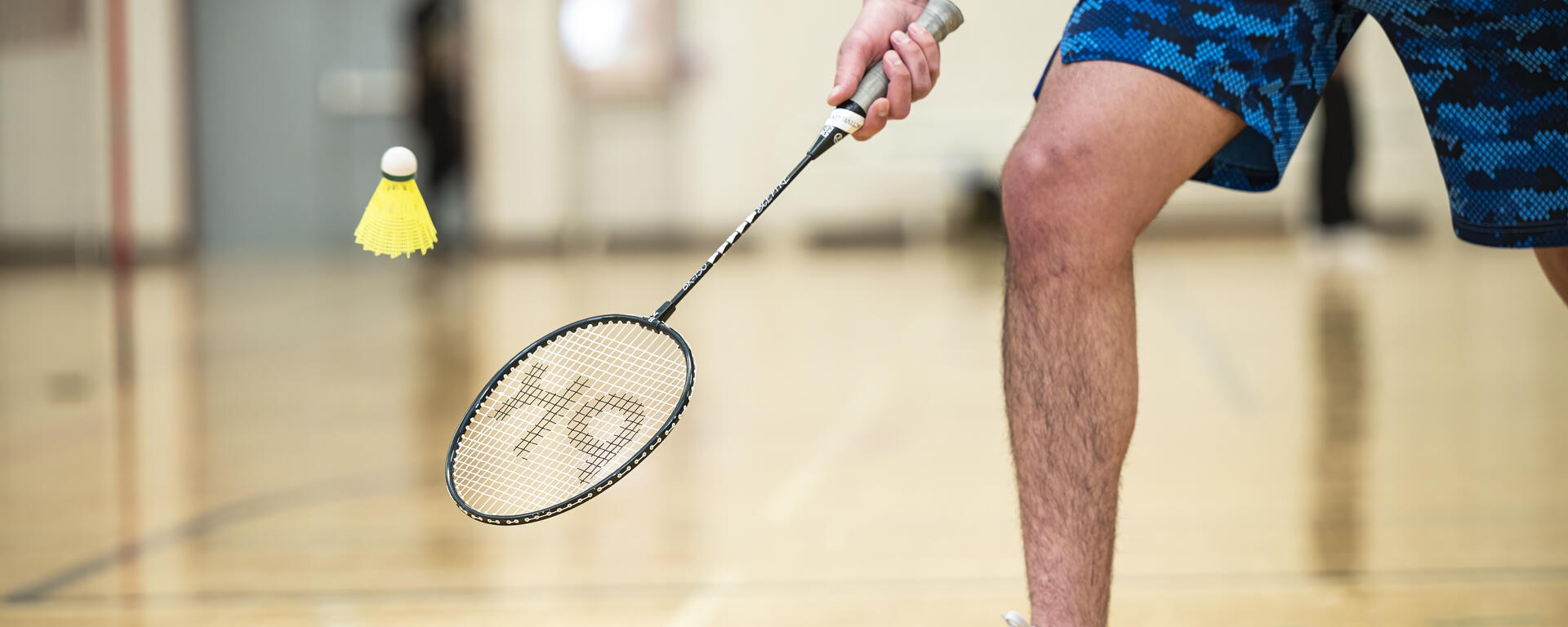 A person playing badminton