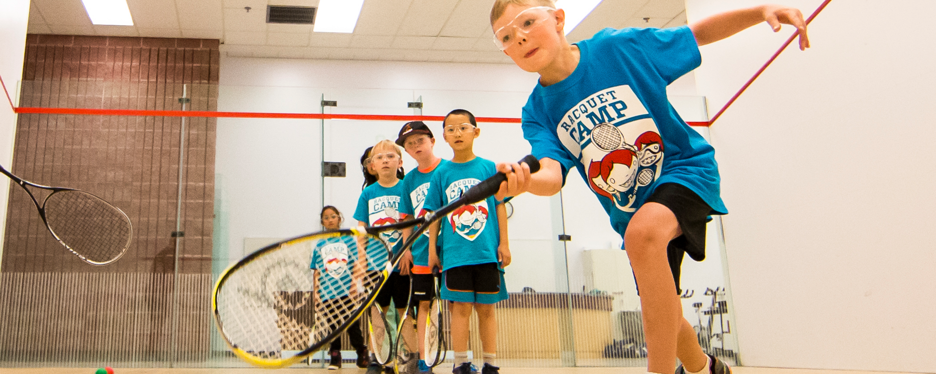 Kids playing racquet ball