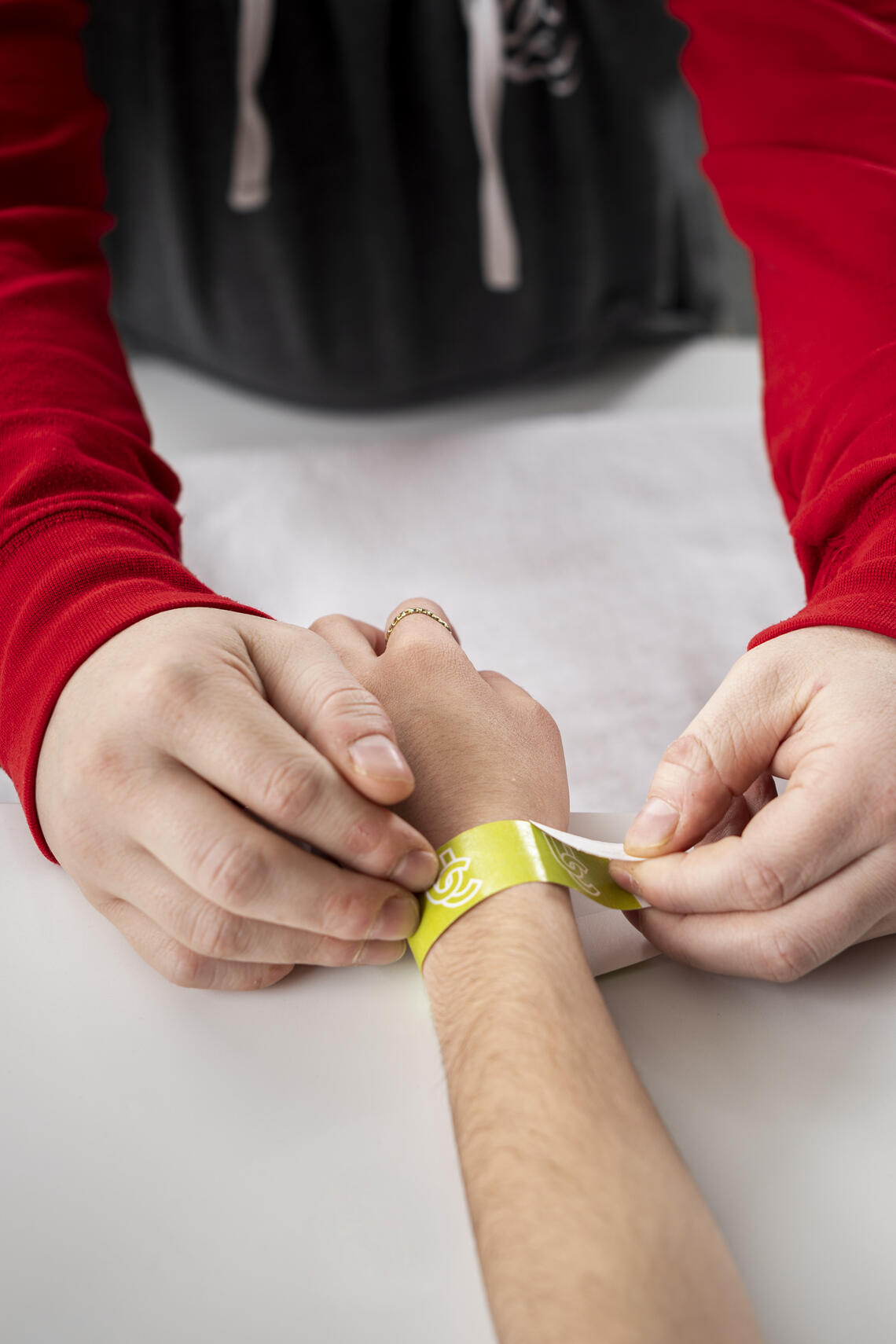 Person putting on wristband 