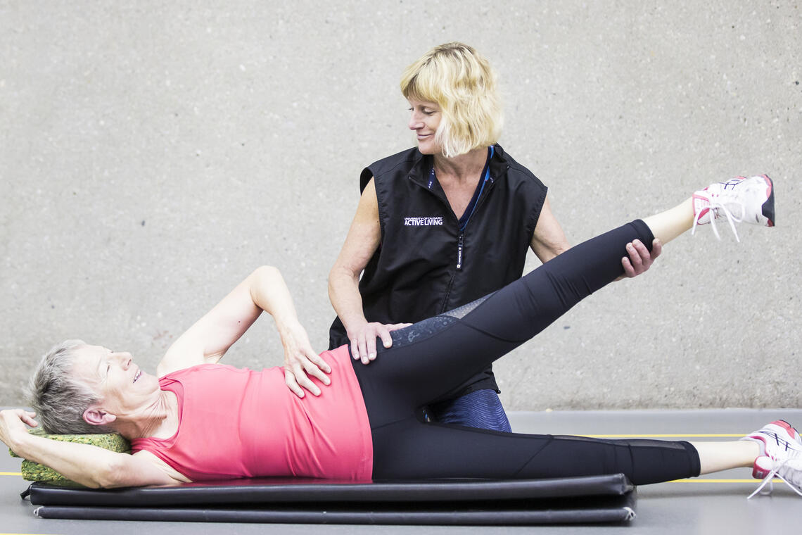 person helping rehab participant