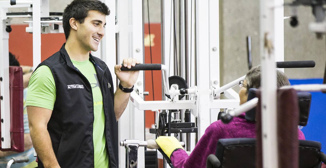 personal trainer consulting with client