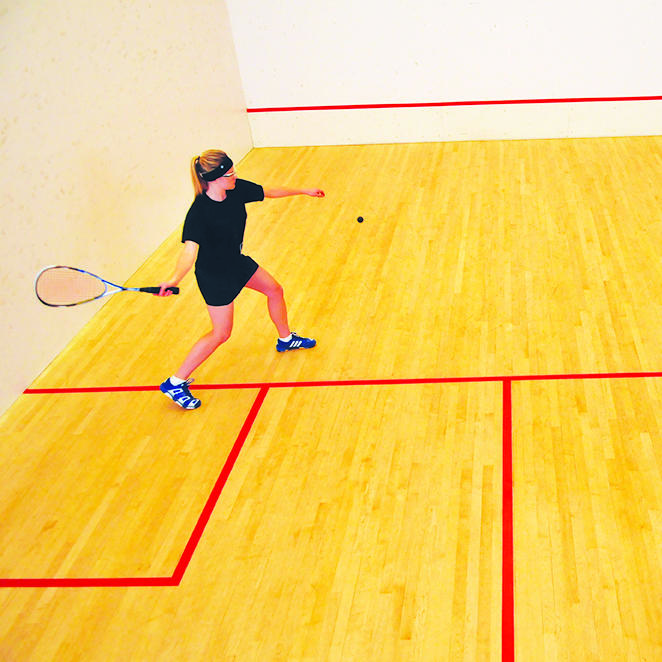 Woman playing squash
