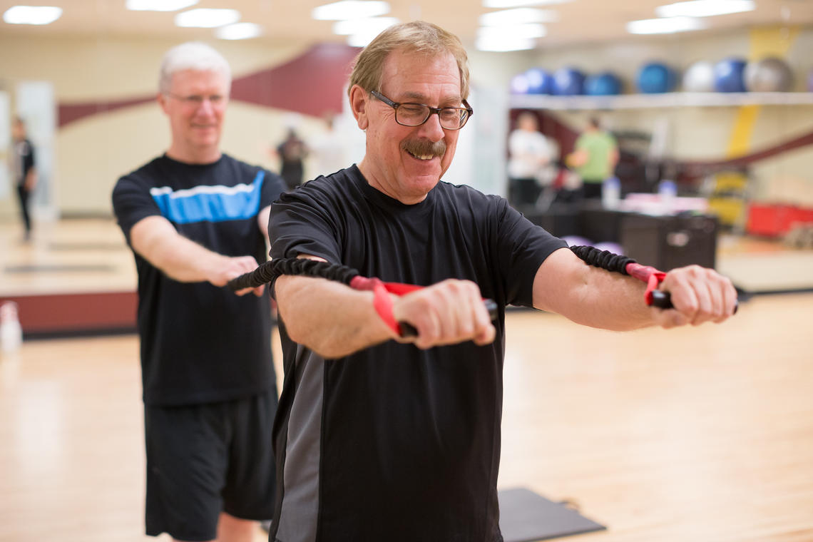 TrymGym client does upper body resistance workout with partner