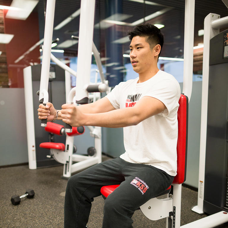 man working out with fitness equipment