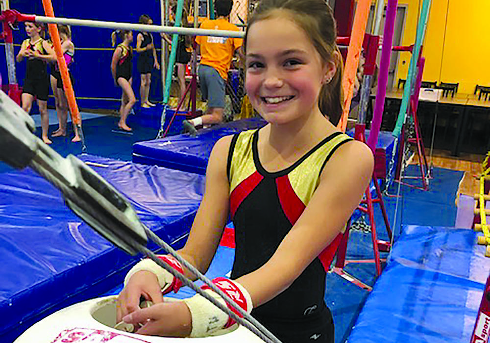 Gymnast chalks up for class