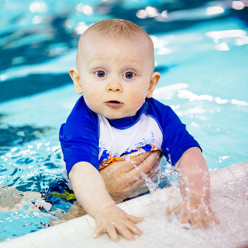 Baby playing in UCalgary pool