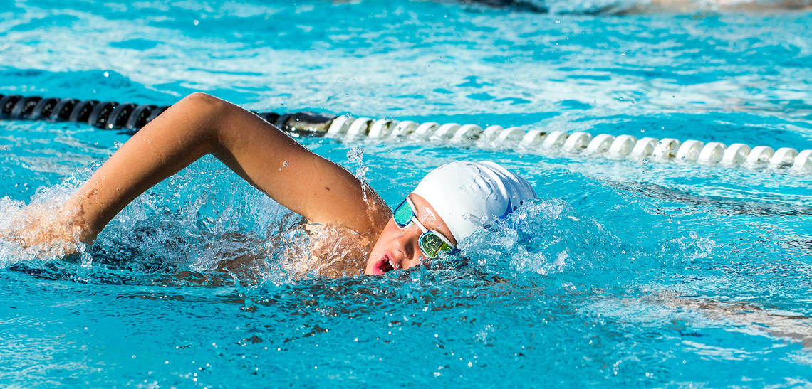 Swimmer doing laps in pool