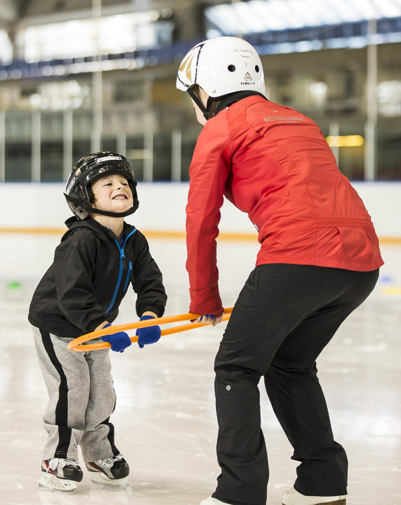 Kid taking skating lessons at University of Calgary