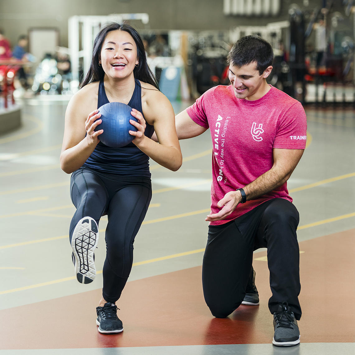 Woman receiving personal training session at UCalgary Fitness Centre