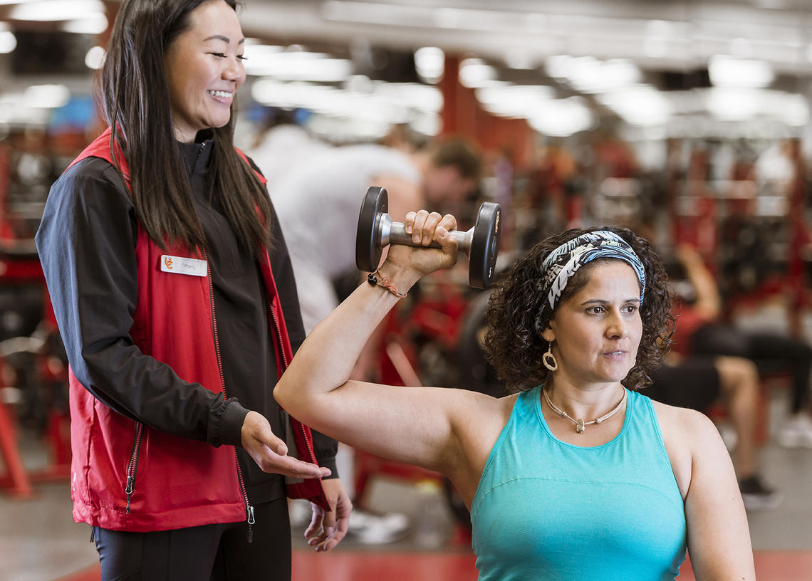 Woman in personal training weight session at UCalgary Fitness Centre