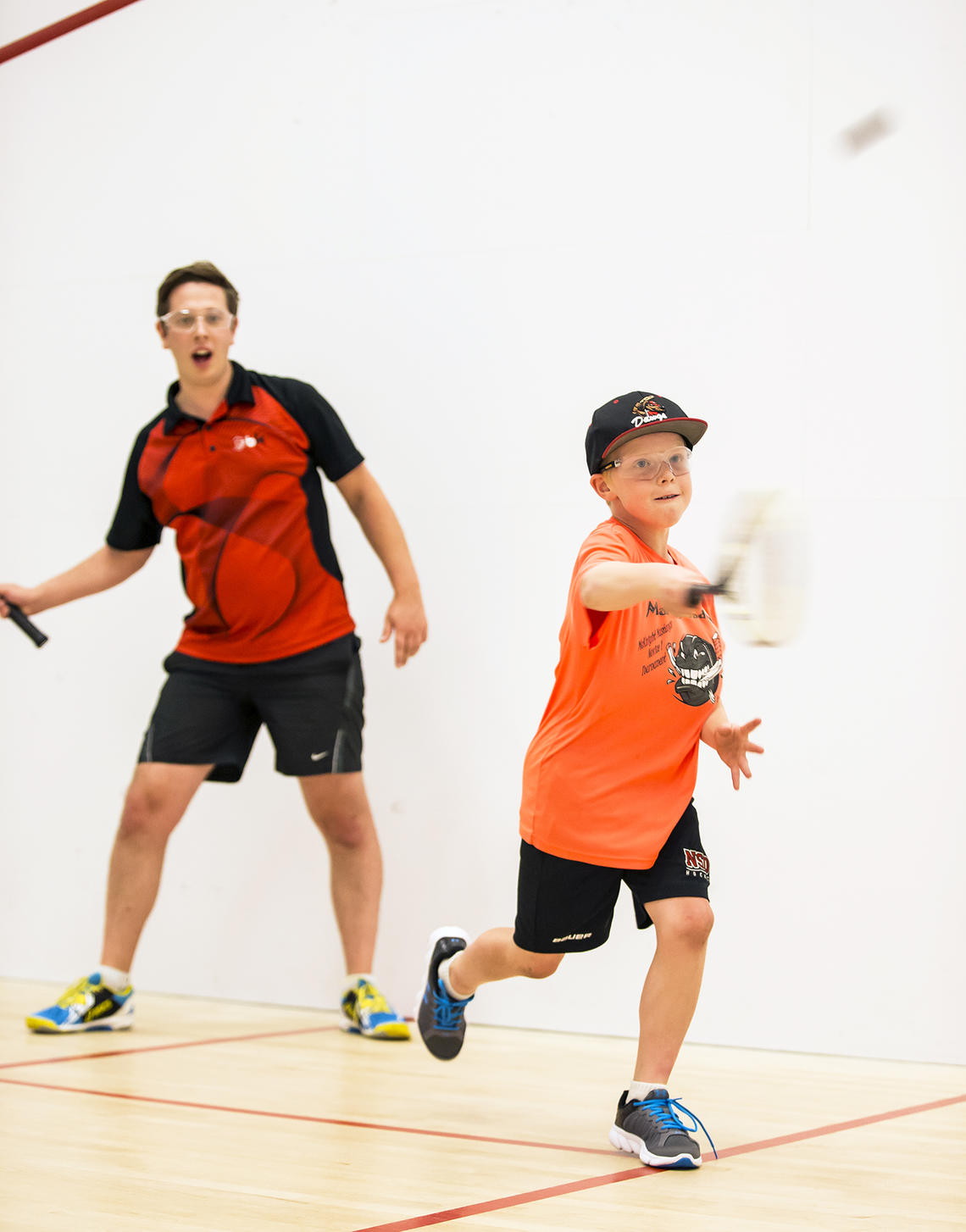 Boy in a racquet sport lesson at UCalgary