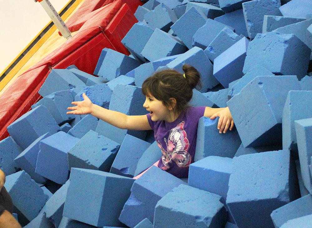 Child at UCalgary Gymnastic Centre in foam pit