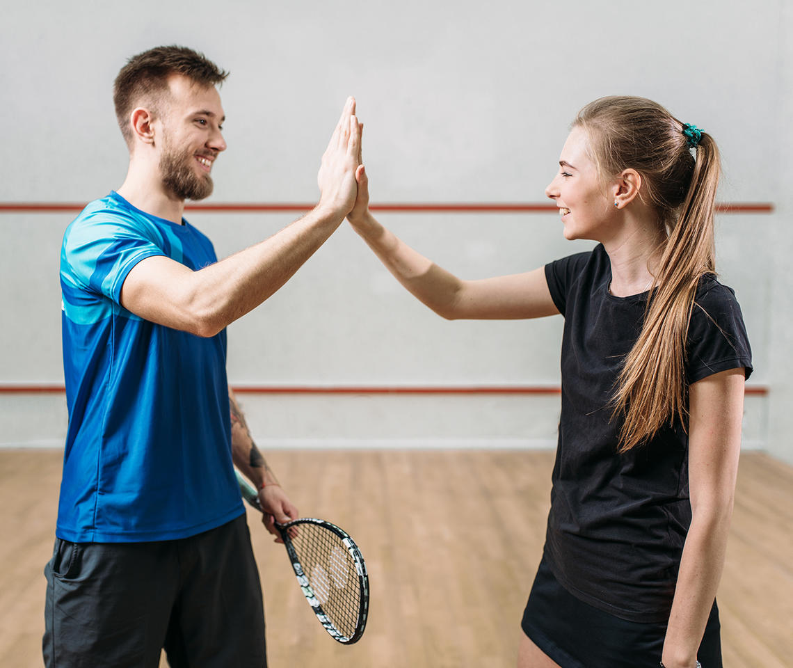 Man and woman in racquet centre