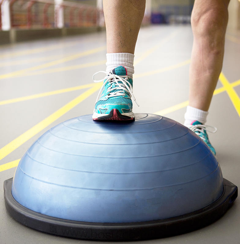 JointEffort patient places foot on fitness ball JointEffort patient places foot on fitness ball
