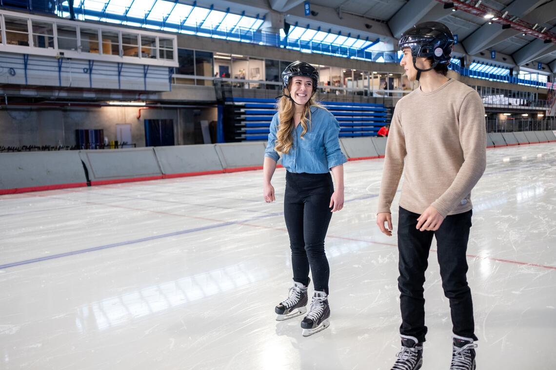 two people skating on the ice