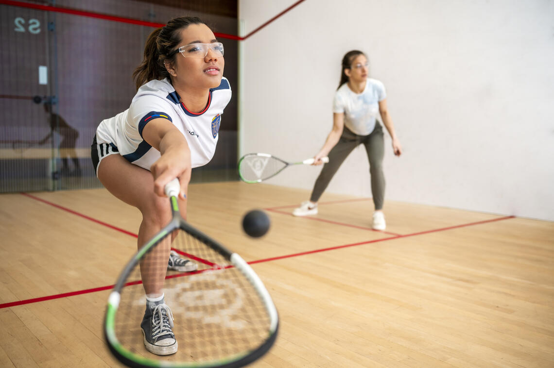 Women playing racquet ball