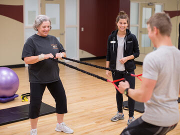 Women training with a trainer