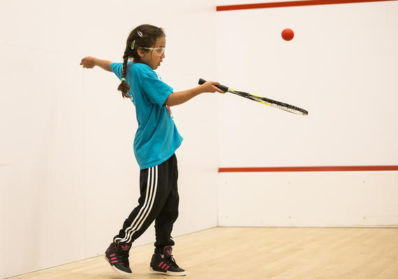 Kid playing racquet sports at University of Calgary
