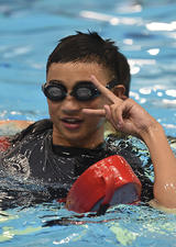 swimmer learning lifeguard skills