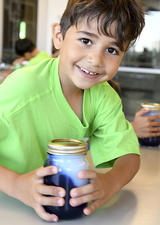 Kid doing science experiment at UCalgary