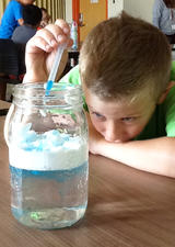 Geography camper observing an experiment